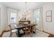 Elegant dining room with a large wooden table, chandelier, and neutral decor at 2759 Arbor Se Ave, Atlanta, GA 30317
