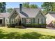 Charming green bungalow with a symmetrical design and well-manicured lawn at 2759 Arbor Se Ave, Atlanta, GA 30317