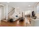 Bright living room featuring hardwood floors, white walls, and a staircase at 2759 Arbor Se Ave, Atlanta, GA 30317
