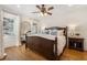 Inviting bedroom with hardwood floors, natural light, a ceiling fan and a large framed mirror at 2759 Arbor Se Ave, Atlanta, GA 30317