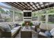 Relaxing screened porch features cozy seating, fireplace, and outdoor views at 2759 Arbor Se Ave, Atlanta, GA 30317