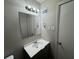 A bathroom featuring a vanity, sink, mirror, and light fixture at 5183 Mccarter Ct, Stone Mountain, GA 30088