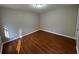Spacious bedroom with hardwood floors, neutral paint, and a closet at 5183 Mccarter Ct, Stone Mountain, GA 30088