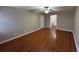 Spacious bedroom with hardwood floors and a ceiling fan at 5183 Mccarter Ct, Stone Mountain, GA 30088