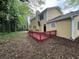 Exterior with a deck and wooded surroundings at 5183 Mccarter Ct, Stone Mountain, GA 30088