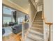 View of a spacious living room and staircase featuring hardwood floors and neutral tones at 710 Bentgrass Ct, Dacula, GA 30019