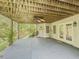Spacious outdoor patio with a ceiling fan and French doors offers a flexible outdoor living area at 710 Bentgrass Ct, Dacula, GA 30019