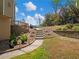 Landscaped backyard with a charming walkway and lush green surroundings at 3544 Candytuft Run, Auburn, GA 30011