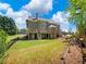 The backyard features a large yard, a deck, and a patio area perfect for entertaining at 3544 Candytuft Run, Auburn, GA 30011