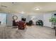 Spacious basement features wood-look flooring, recessed lights, and ample seating at 3544 Candytuft Run, Auburn, GA 30011
