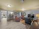 Open basement area with wood-look flooring, recessed lighting, and comfortable seating at 3544 Candytuft Run, Auburn, GA 30011