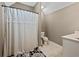 Bathroom featuring a shower with a curtain, a toilet, and a vanity with sink at 3544 Candytuft Run, Auburn, GA 30011