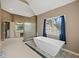 Bathroom featuring a modern freestanding tub, shower, and vanity with sink at 3544 Candytuft Run, Auburn, GA 30011