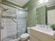 Accessible bathroom with a step-in shower, grab bars, and modern fixtures and marble vanity at 3544 Candytuft Run, Auburn, GA 30011