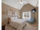 Bedroom featuring a bed, sitting chair, tv, and window with natural light at 3544 Candytuft Run, Auburn, GA 30011