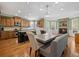 Bright dining area with a fireplace, an island, a spacious island and granite countertops at 3544 Candytuft Run, Auburn, GA 30011