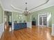 Formal dining room boasts hardwood floors, buffet, and accent lighting and trim at 3544 Candytuft Run, Auburn, GA 30011