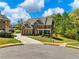 Stunning brick home with a well-manicured lawn, and a long driveway on a sunny day at 3544 Candytuft Run, Auburn, GA 30011
