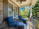 Cozy front porch featuring comfortable blue seating, a ceiling fan, and a serene outdoor ambiance at 3544 Candytuft Run, Auburn, GA 30011
