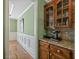 Elegant hallway with custom cabinetry, granite countertop and a stylish coffee station at 3544 Candytuft Run, Auburn, GA 30011