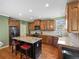 Well-equipped kitchen featuring granite countertops, stainless steel appliances, and a center island at 3544 Candytuft Run, Auburn, GA 30011