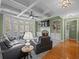 Inviting living room with coffered ceilings, a stone fireplace, large windows and access to outdoor views at 3544 Candytuft Run, Auburn, GA 30011