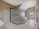 Beautiful main bathroom features a glass enclosed shower, soaking tub, and neutral walls at 3544 Candytuft Run, Auburn, GA 30011