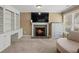 The primary bedroom includes a cozy fireplace, a built in bookcase, and natural lighting at 3544 Candytuft Run, Auburn, GA 30011