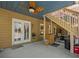 Open patio with stairs offers outdoor access and space for entertainment at 3544 Candytuft Run, Auburn, GA 30011