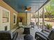 Relaxing covered patio features ceiling fan, stylish furniture, and decorative rug at 3544 Candytuft Run, Auburn, GA 30011
