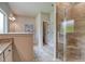Modern bathroom featuring granite countertops, a walk-in shower with tile surround, and neutral colors at 700 Relic Rdg, Hampton, GA 30228