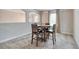 Cozy dining area featuring a round table with four chairs and an arched doorway at 700 Relic Rdg, Hampton, GA 30228