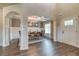 Spacious dining room with coffered ceiling and view of the front entry at 700 Relic Rdg, Hampton, GA 30228