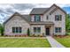 Charming brick home with well-maintained landscaping, a covered entrance, and welcoming curb appeal at 700 Relic Rdg, Hampton, GA 30228