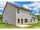 Well-manicured lawn surrounds this home's exterior, complete with a private patio at 700 Relic Rdg, Hampton, GA 30228
