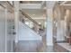 Open foyer with wood floors, staircase, and a view of the living spaces at 700 Relic Rdg, Hampton, GA 30228