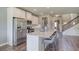 Modern kitchen featuring stainless steel appliances, granite countertops, and a large island with seating at 700 Relic Rdg, Hampton, GA 30228