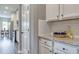 Kitchen with white cabinets, granite counters, stainless steel appliances, and subway tile backsplash at 700 Relic Rdg, Hampton, GA 30228