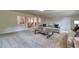 A neutral color palette and plush carpet make this living room feel warm and inviting at 700 Relic Rdg, Hampton, GA 30228