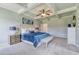 Spacious main bedroom showcasing a tray ceiling, soft carpet, and an ensuite bath at 700 Relic Rdg, Hampton, GA 30228