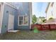 Exterior side view with access door, window and small backyard at 974 Regal Hills Ln, Mableton, GA 30126