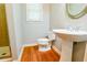 Bathroom with a pedestal sink, toilet, and tiled shower at 974 Regal Hills Ln, Mableton, GA 30126