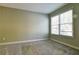 Bedroom featuring neutral carpet and a large window at 974 Regal Hills Ln, Mableton, GA 30126