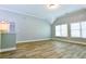 Spacious bonus room with laminate flooring, high ceilings and natural light at 974 Regal Hills Ln, Mableton, GA 30126