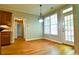 Dining area features hardwood floors, natural lighting, and elegant chandelier at 974 Regal Hills Ln, Mableton, GA 30126
