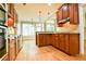 Spacious kitchen with wooden cabinets, granite countertops, and stainless steel appliances, blending functionality and elegance at 974 Regal Hills Ln, Mableton, GA 30126