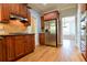 Charming kitchen with wooden cabinets and stainless steel refrigerator at 974 Regal Hills Ln, Mableton, GA 30126