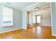 Sunlit living room with hardwood flooring, white trim, and an open layout, blending style and comfort at 974 Regal Hills Ln, Mableton, GA 30126