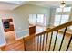 View from the staircase looking into the living room and kitchen at 974 Regal Hills Ln, Mableton, GA 30126