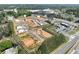 Beautiful aerial view of new construction neighborhood and future amenities surrounded by lush trees at 120 Winsome Way, Woodstock, GA 30188